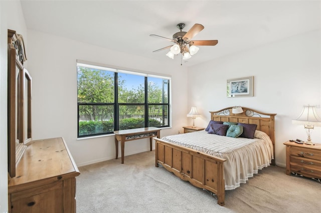 3390 Fallbrook Dr, Kissimmee, FL 34759 - bedroom featuring light carpet, ceiling fan, and baseboards