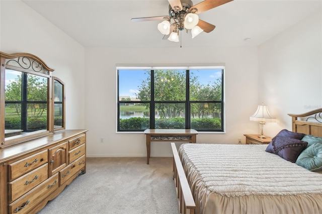 3390 Fallbrook Dr, Kissimmee, FL 34759 - bedroom featuring a ceiling fan, light colored carpet, and baseboards