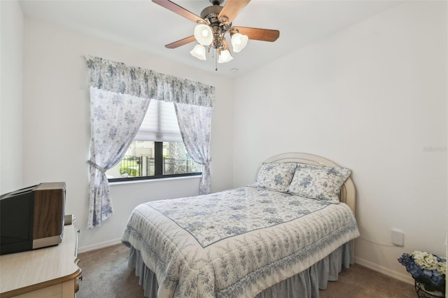 3390 Fallbrook Dr, Kissimmee, FL 34759 - carpeted bedroom with a ceiling fan and baseboards