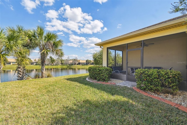 3390 Fallbrook Dr, Kissimmee, FL 34759 - view of yard with a water view, a sunroom, and a ceiling fan