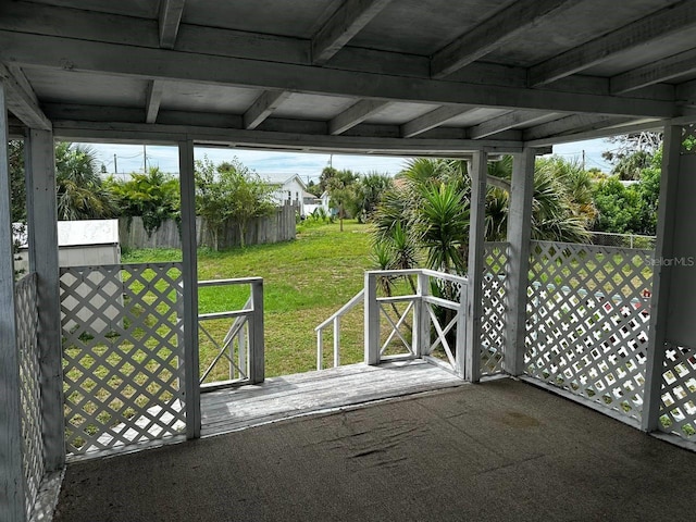 view of gate featuring a yard and fence