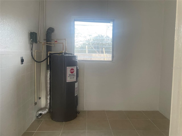 utility room featuring electric water heater