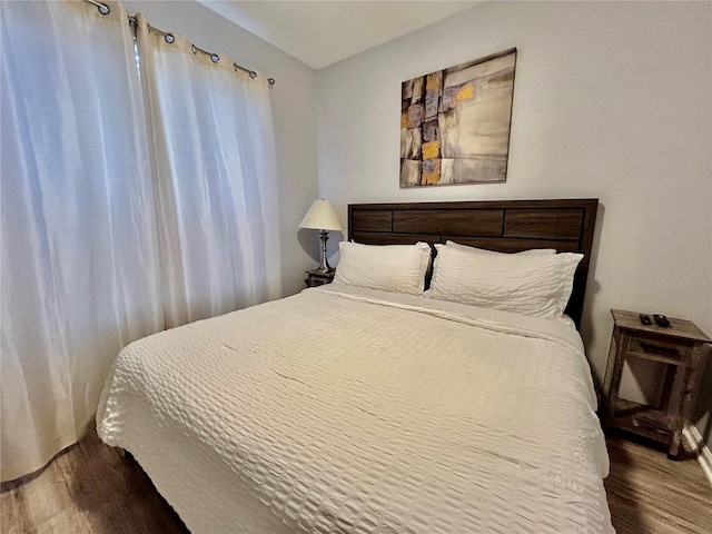 bedroom featuring wood finished floors