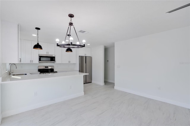 kitchen with visible vents, white cabinets, appliances with stainless steel finishes, light countertops, and a sink