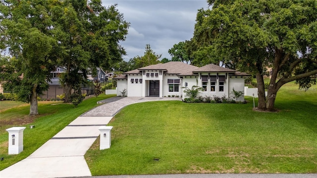 prairie-style home featuring a front yard