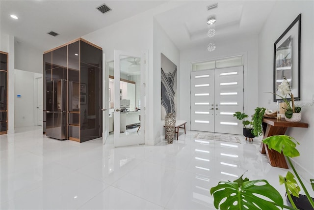 entryway featuring french doors and visible vents