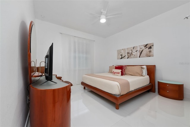 tiled bedroom featuring ceiling fan