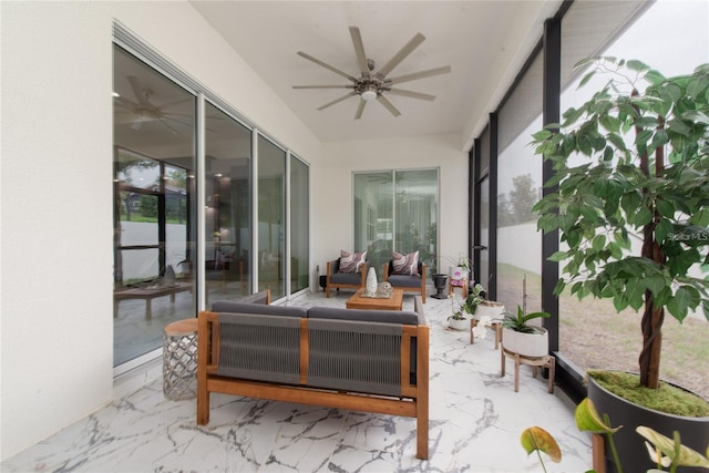 sunroom with ceiling fan