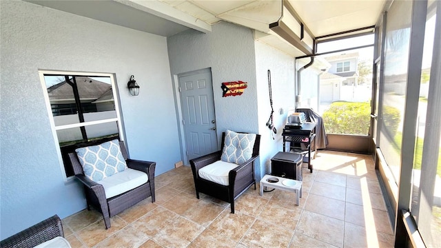 sunroom / solarium with beamed ceiling