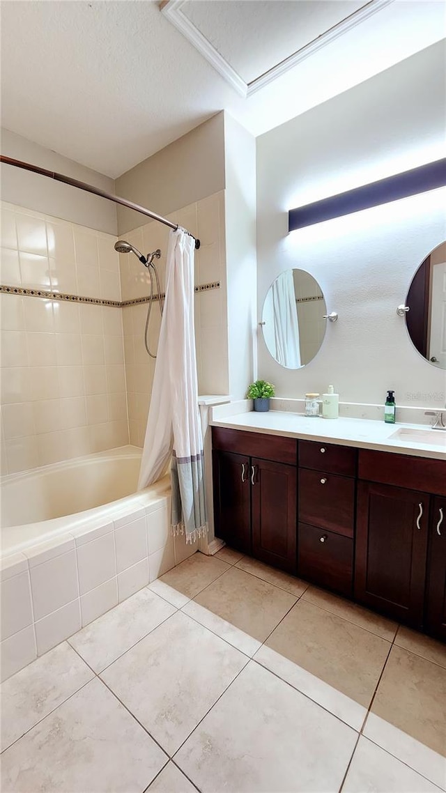 full bath with tiled shower / bath, double vanity, tile patterned flooring, and a sink