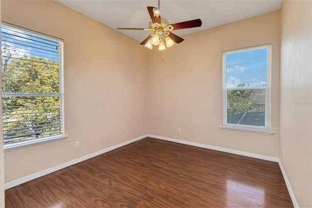 unfurnished room with ceiling fan, baseboards, and wood finished floors