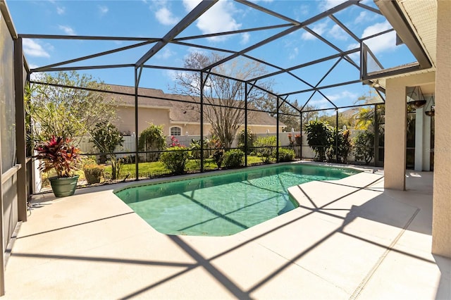 view of swimming pool featuring a lanai, a patio area, and a fenced in pool