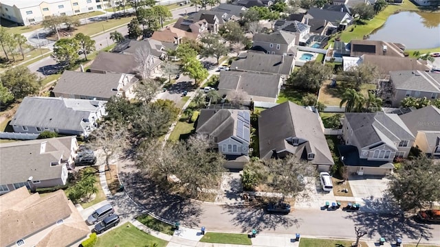 birds eye view of property featuring a water view and a residential view