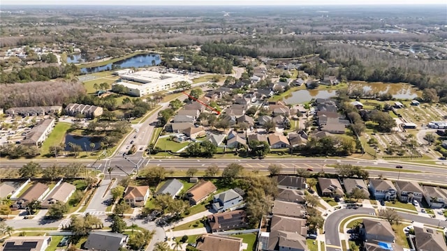 birds eye view of property featuring a water view and a residential view