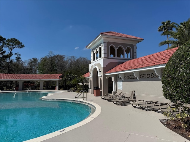 community pool with a patio