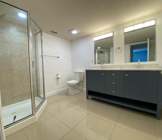 full bath featuring toilet, a sink, visible vents, a shower stall, and double vanity