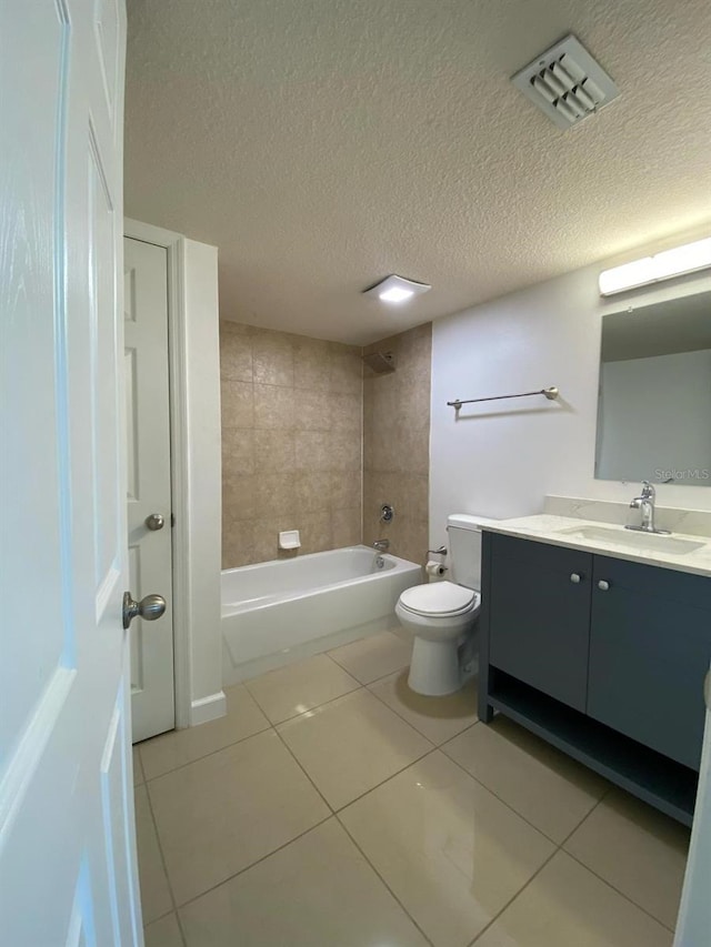 bathroom featuring visible vents, toilet, tile patterned flooring, vanity, and shower / washtub combination