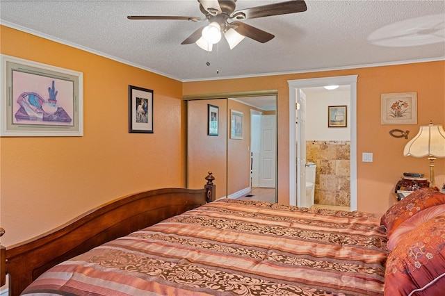 bedroom with a ceiling fan, connected bathroom, ornamental molding, a textured ceiling, and a closet