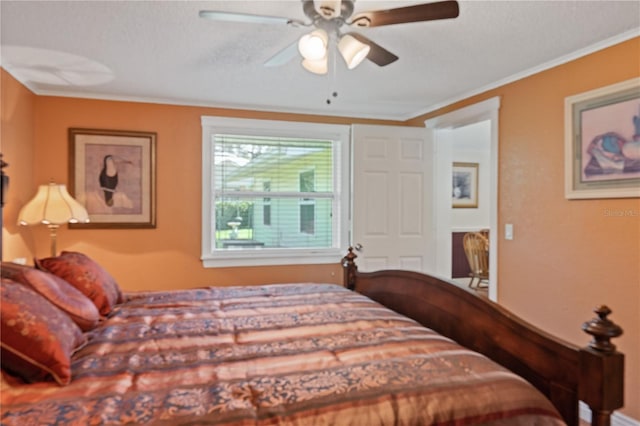 bedroom with ornamental molding and a ceiling fan