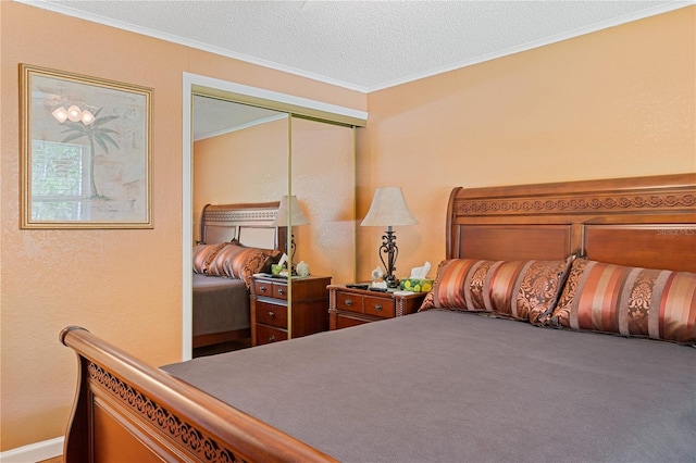 bedroom with a textured ceiling, ornamental molding, a closet, and carpet flooring