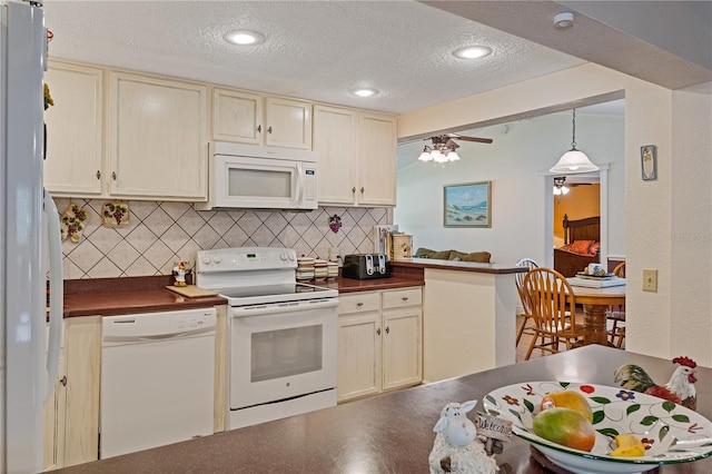 kitchen with dark countertops, white appliances, backsplash, and a textured ceiling