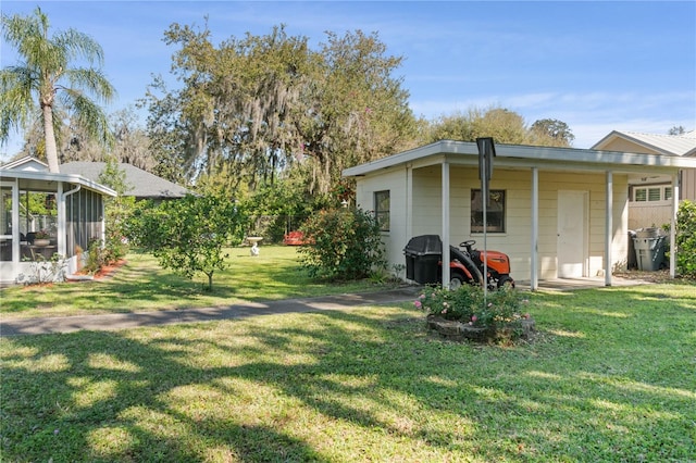 view of yard featuring a sunroom