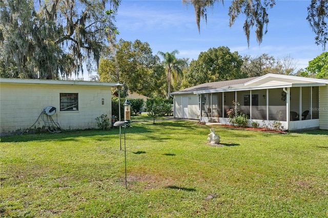 view of yard featuring a sunroom