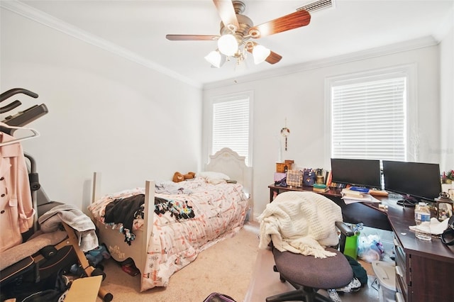 carpeted bedroom featuring ceiling fan, visible vents, and crown molding