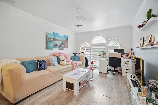 interior space with ornamental molding, visible vents, and wood finished floors