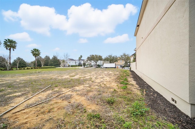 view of yard featuring a residential view