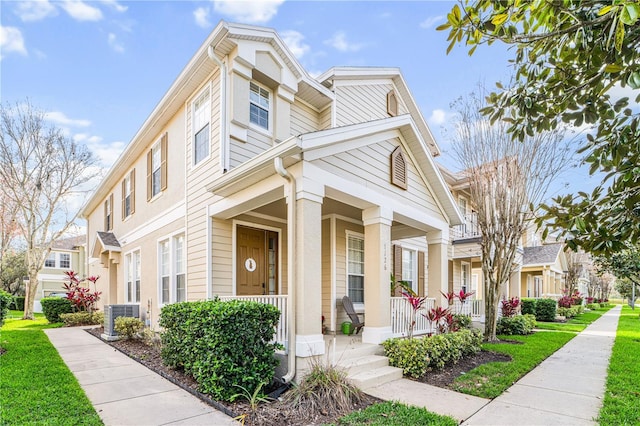 view of front of property with central AC unit and a porch