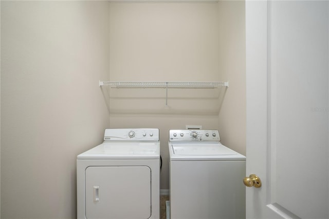 laundry room featuring laundry area and washer and clothes dryer