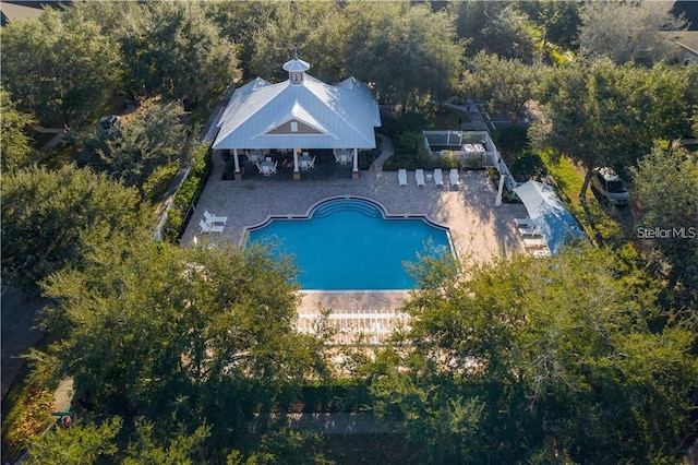 outdoor pool with a patio area