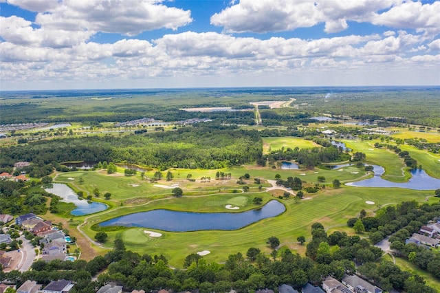 birds eye view of property featuring golf course view and a water view