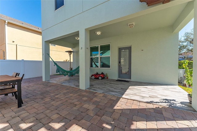 view of patio featuring fence