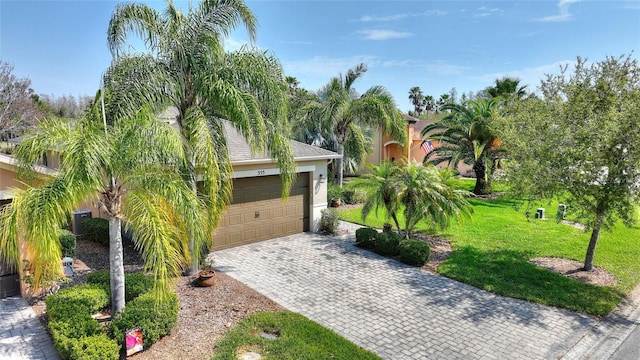 obstructed view of property featuring stucco siding and a front yard