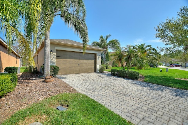 garage with decorative driveway