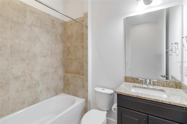 full bathroom featuring washtub / shower combination, vanity, and toilet