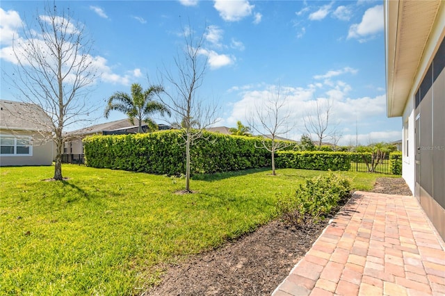 view of yard with fence and a patio