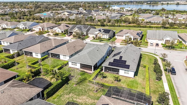 aerial view with a residential view and a water view