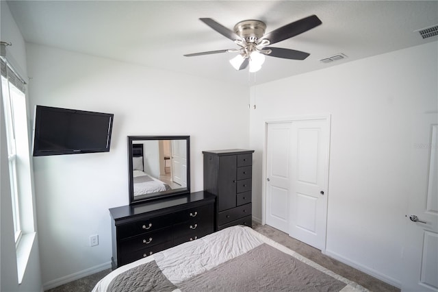 unfurnished bedroom featuring a closet, visible vents, baseboards, and carpet flooring