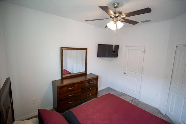 bedroom featuring light colored carpet, visible vents, ceiling fan, and baseboards