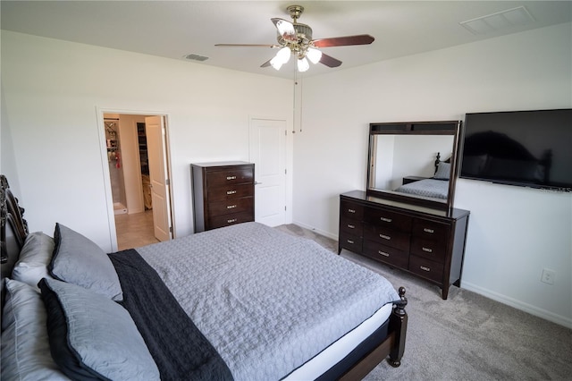 bedroom with carpet floors, visible vents, and baseboards