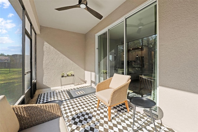 sunroom / solarium with ceiling fan