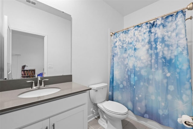 full bath with visible vents, toilet, vanity, a shower with curtain, and tile patterned floors