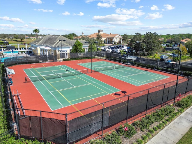 view of tennis court with fence