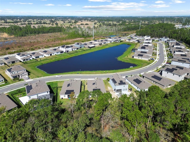 drone / aerial view with a water view and a residential view