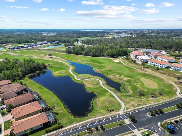 birds eye view of property with a water view and golf course view