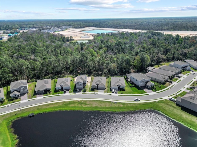 birds eye view of property with a residential view and a water view