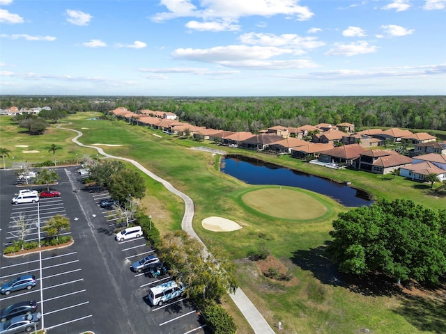 aerial view featuring a water view and golf course view